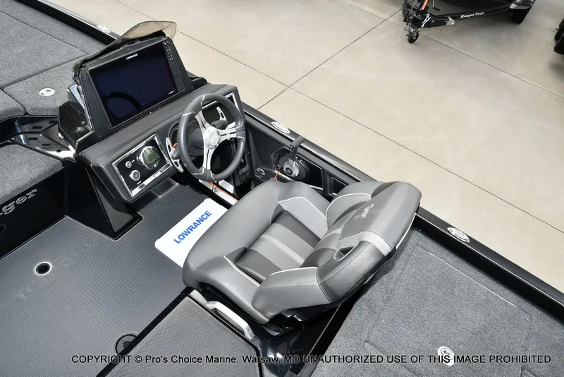 Slide: The Image of 2023 Ranger Z520R boat cockpit with steering wheel and Lowrance display. - 47
