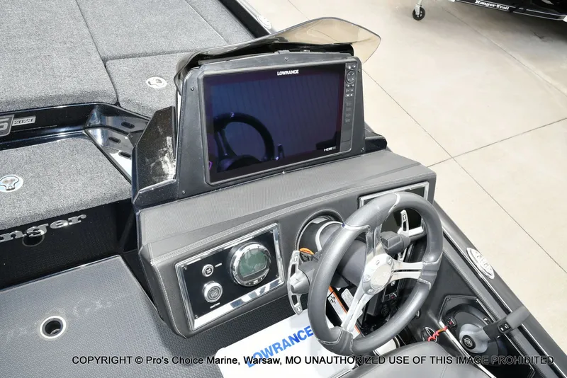 Slide: The Image of 2023 Ranger Z520R boat dashboard with steering wheel and Lowrance display. - 48