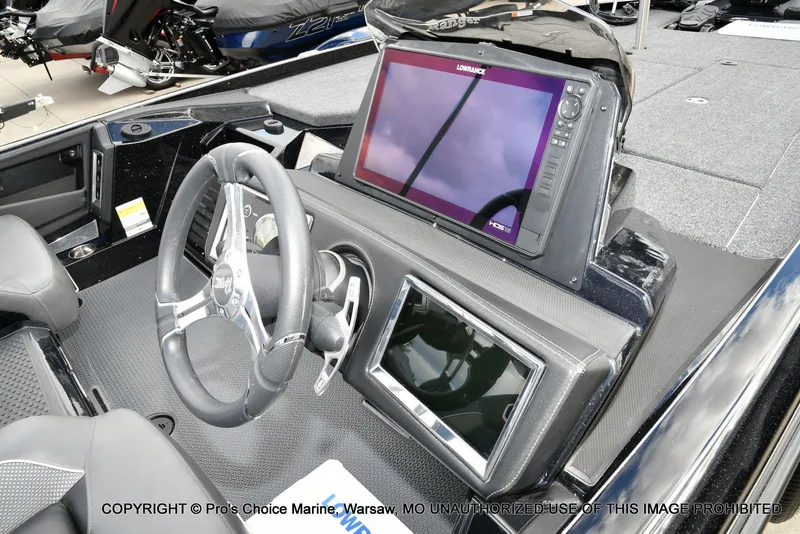 Slide: The Image of 2023 Ranger Z520R boat dashboard with steering wheel and Lowrance HDS display. - 8