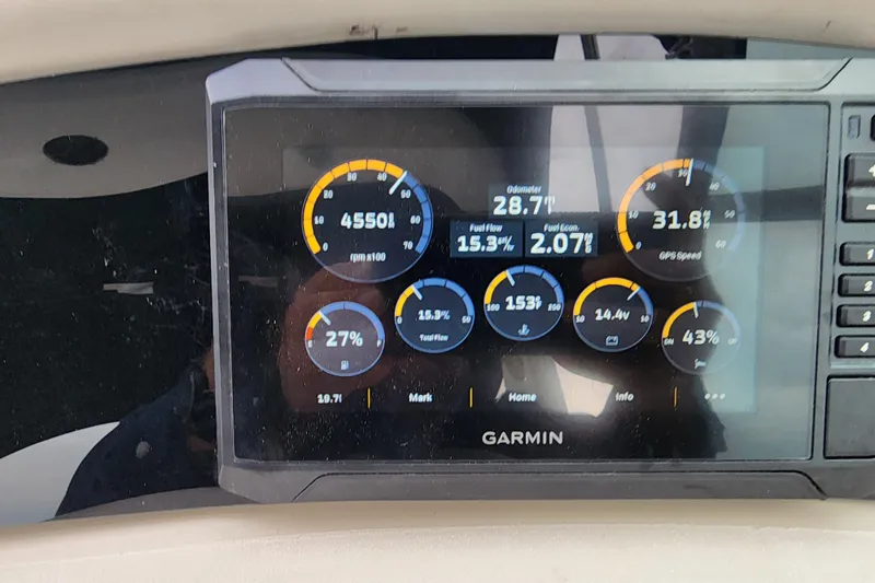 Slide: The Image of Garmin display on 2003 Sea Ray Sundancer 260 showing RPM, speed, and fuel data. - 9