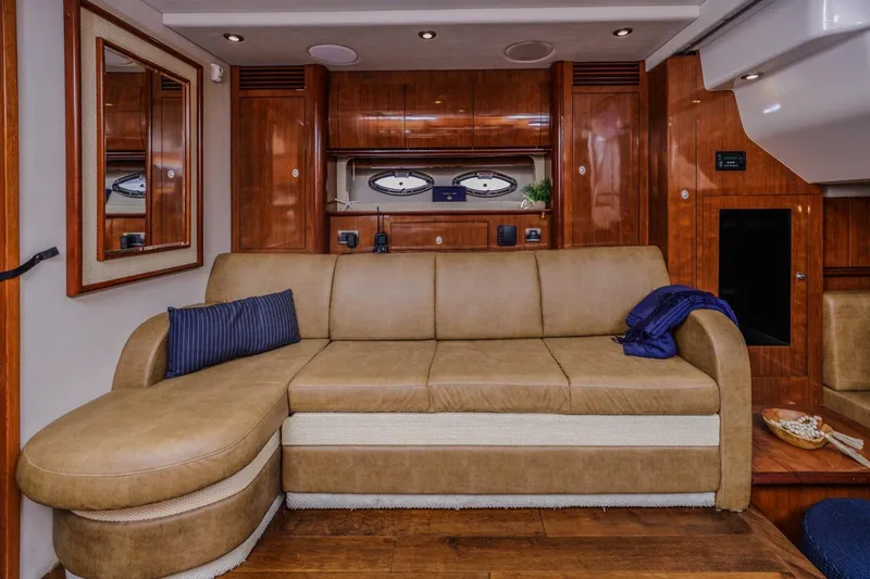 Slide: The Image of Luxurious interior of 2005 Sea Ray 390 Sundancer yacht with leather seating and wooden accents. - 20