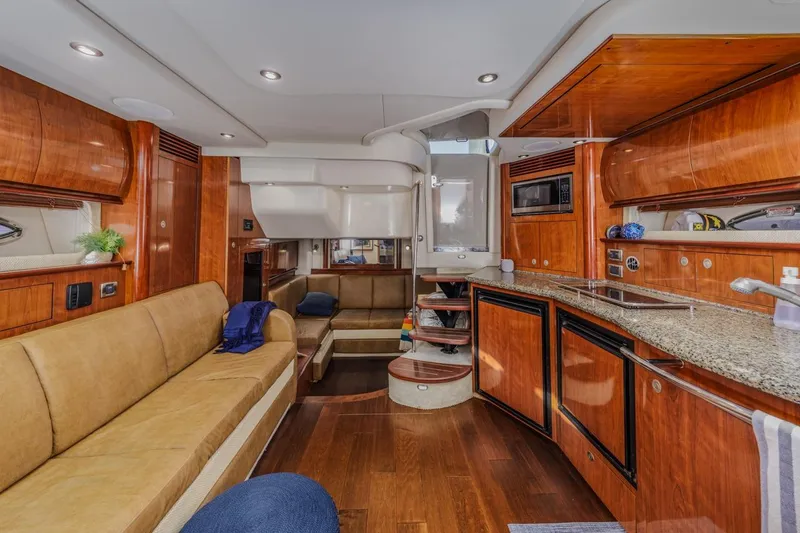 Slide: The Image of Luxurious interior of 2005 Sea Ray 390 Sundancer yacht with wood finishes and modern amenities. - 21
