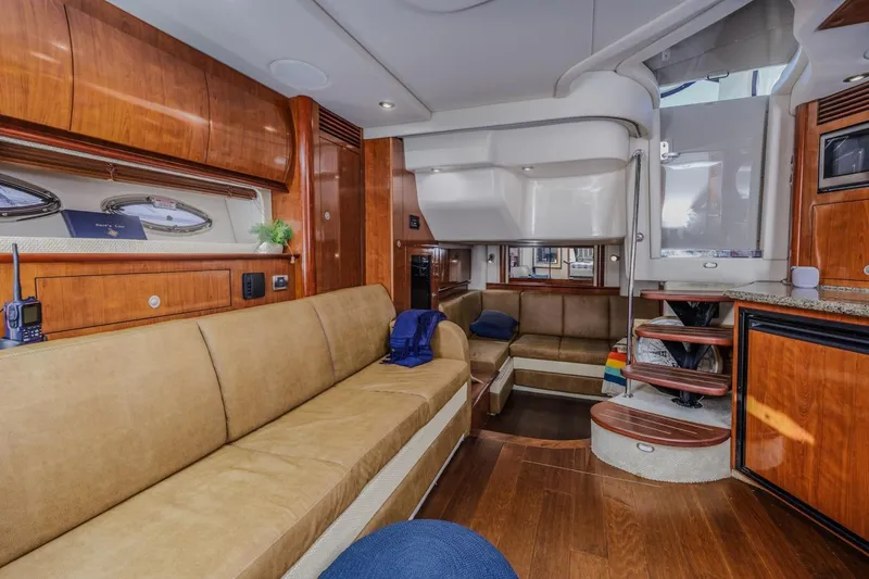Slide: The Image of Luxurious interior of a 2005 Sea Ray 390 Sundancer yacht with wooden finishes. - 23