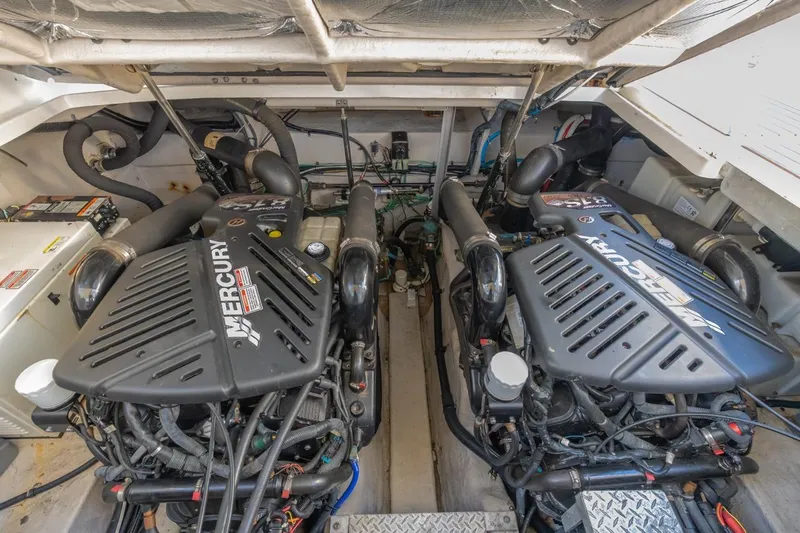 Slide: The Image of Engine room of 2005 Sea Ray 390 Sundancer with twin Mercury engines. - 31