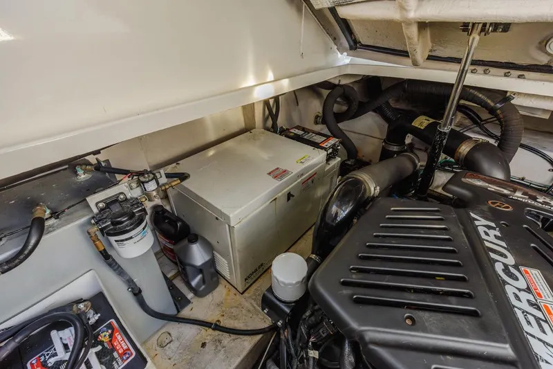 Slide: The Image of Engine compartment of 2005 Sea Ray 390 Sundancer with Mercury components and equipment. - 32