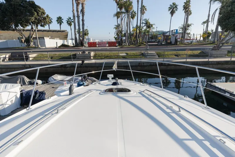 Slide: The Image of 2005 Sea Ray 390 Sundancer yacht docked near palm trees and waterfront. - 7