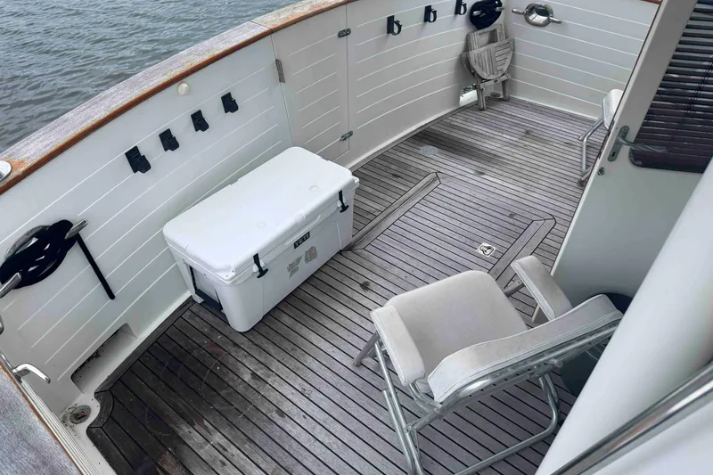 Slide: The Image of 1998 Krogen Express 49 yacht docked beside another boat in a marina. - 17