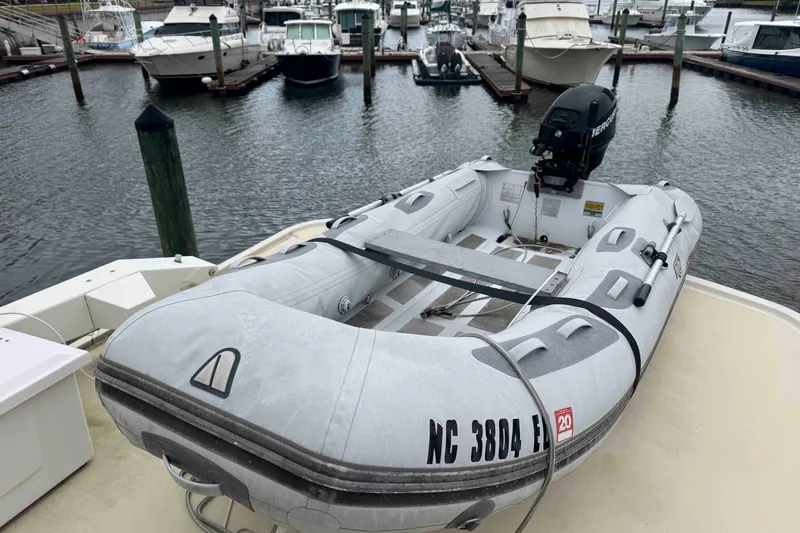 Slide: The Image of 1998 Krogen Express 49 yacht docked beside another boat in a marina. - 23
