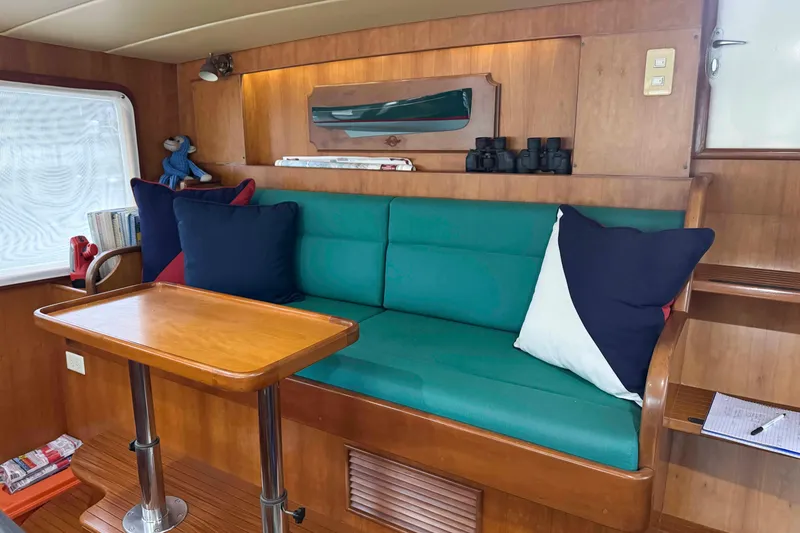 Slide: The Image of Helm of 1998 Krogen Express 49 with wooden dashboard and nautical instruments. - 33