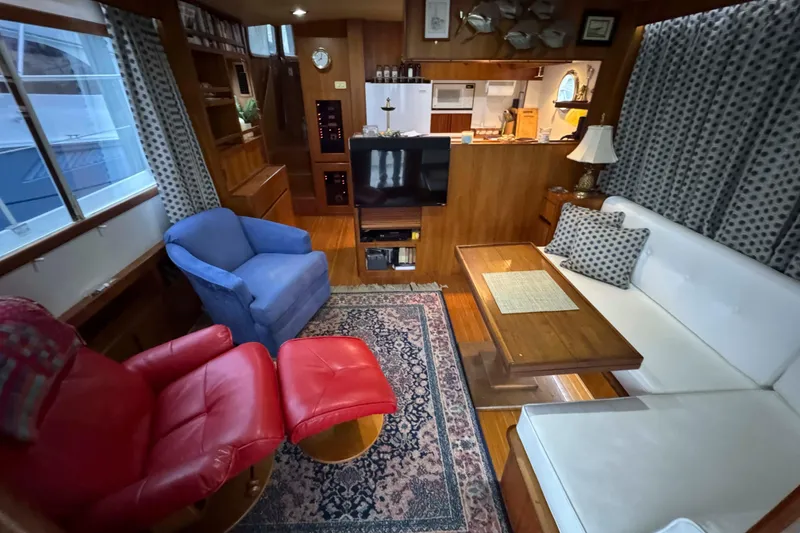 Slide: The Image of Cozy cabin interior of 1998 Krogen Express 49 with wooden accents and bedding. - 42