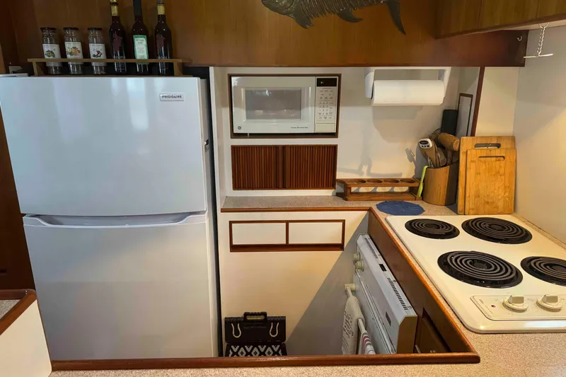 Slide: The Image of Luxurious cabin interior of 1998 Krogen Express 49 with wooden cabinetry and mirror. - 46