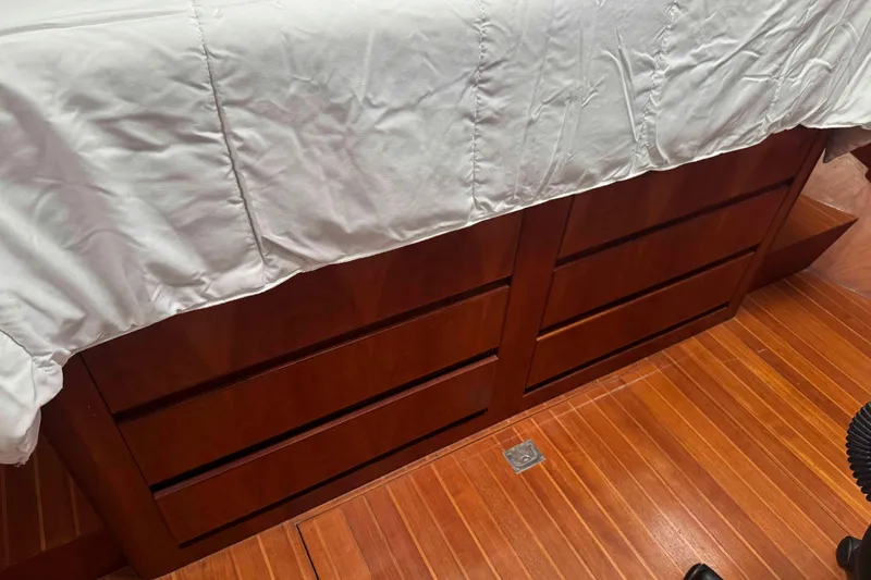 Slide: The Image of Cozy seating area in 1998 Krogen Express 49 yacht with patterned cushions and decor. - 53