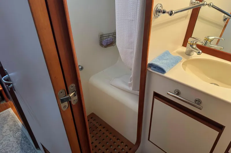 Slide: The Image of Cozy wooden interior of 1998 Krogen Express 49 with desk and tropical artwork. - 58