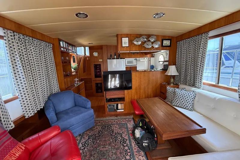 Slide: The Image of Luxurious interior of 1998 Krogen Express 49 yacht with cozy seating and elegant decor. - 60