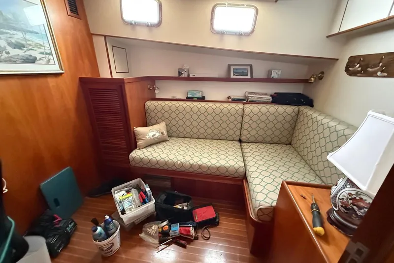 Slide: The Image of Cozy interior of 1998 Krogen Express 49 yacht with cushioned seating and nautical decor. - 68