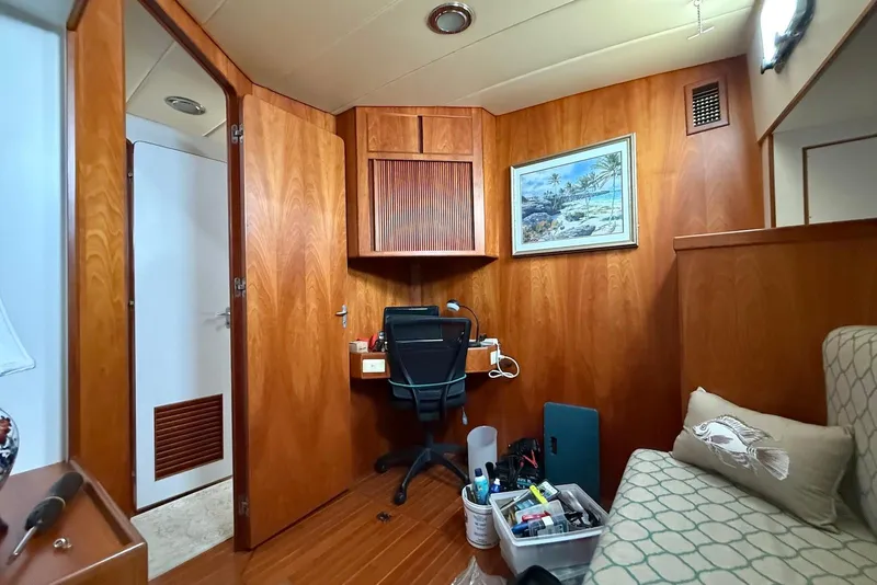Slide: The Image of Cozy cabin interior of 1998 Krogen Express 49 with wooden decor and desk area. - 69