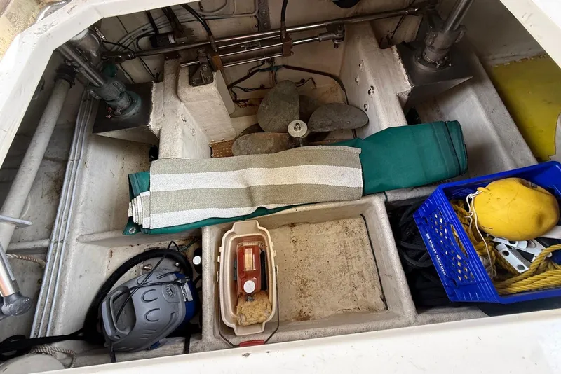 Slide: The Image of Storage compartment of a 1998 Krogen Express 49 boat with various equipment and supplies. - 72