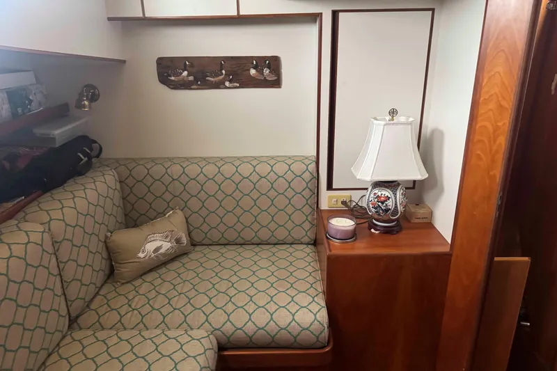 Slide: The Image of Engine room of a 1998 Krogen Express 49 with a yellow marine engine. - 76