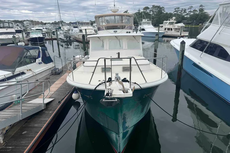 Slide: The Image of 1998 Krogen Express 49 boat deck with seating and storage. - 2