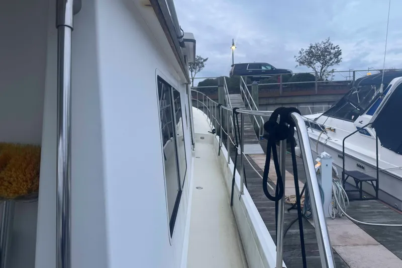 Slide: The Image of Interior of 1998 Krogen Express 49 with wooden stairs and seating area. - 20