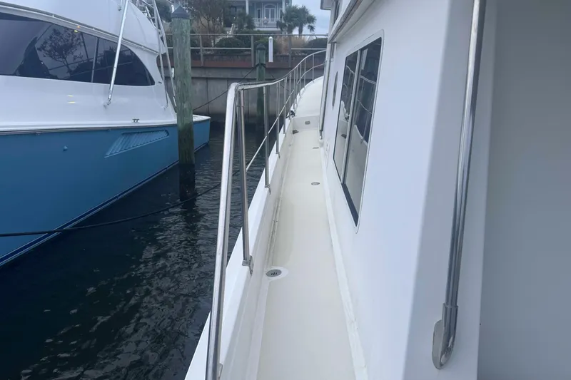 Slide: The Image of Interior view of 1998 Krogen Express 49 boat with wooden paneling and windows. - 21