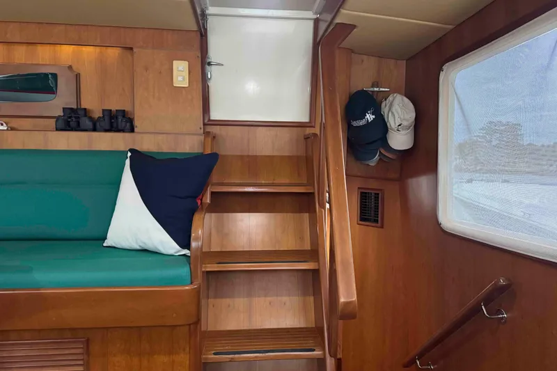 Slide: The Image of Interior of 1998 Krogen Express 49 yacht with cozy seating and elegant decor. - 28