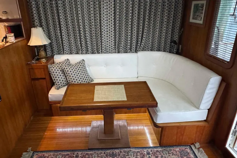 Slide: The Image of Cozy cabin interior of 1998 Krogen Express 49 with wooden accents and plush bedding. - 38