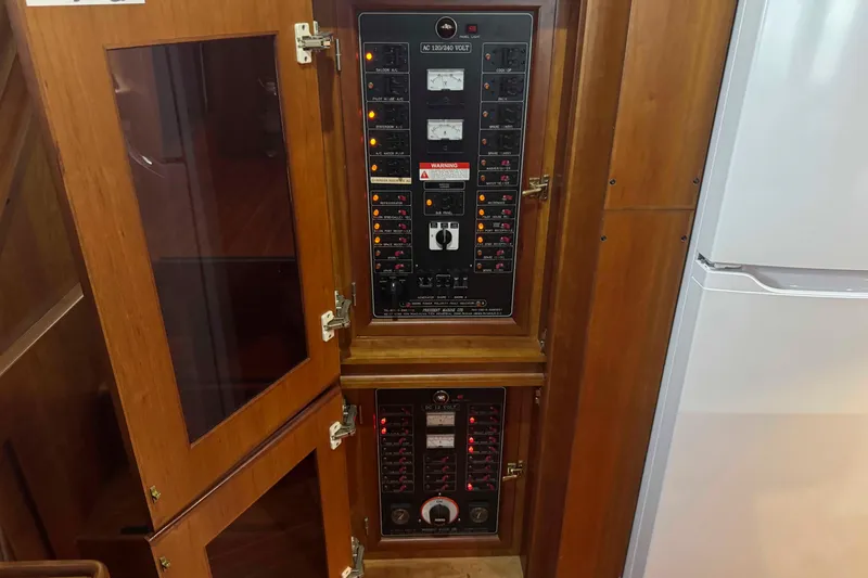 Slide: The Image of Interior of 1998 Krogen Express 49 with wooden paneling and cozy seating. - 42