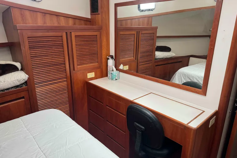 Slide: The Image of Cozy interior of 1998 Krogen Express 49 with patterned sofa and decorative lamp. - 48