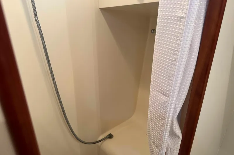 Slide: The Image of Engine room of 1998 Krogen Express 49 with machinery and wiring. - 54