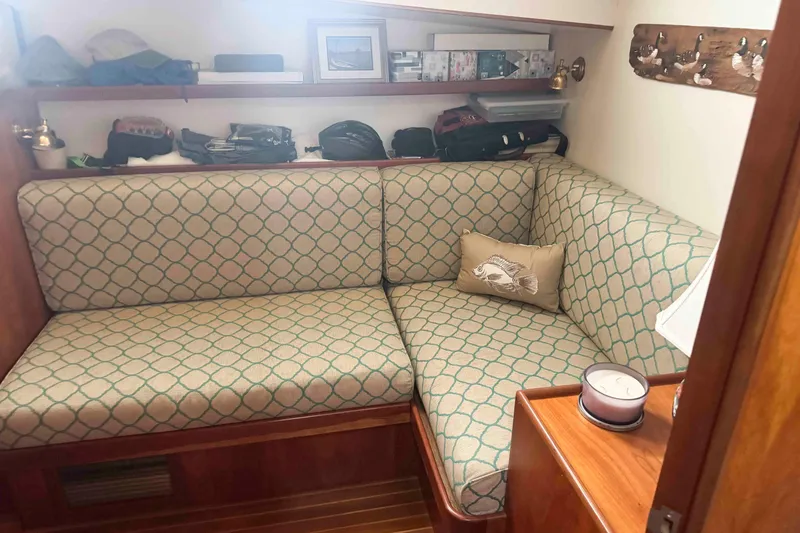 Slide: The Image of Engine room of 1998 Krogen Express 49 with yellow machinery and wiring. - 55