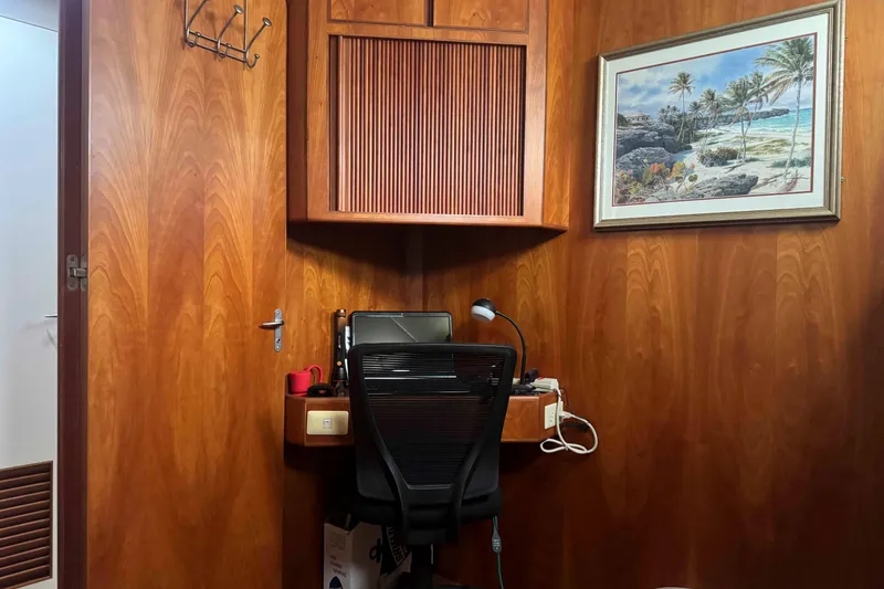 Slide: The Image of Engine room of 1998 Krogen Express 49 yacht, showcasing mechanical components and wiring. - 60