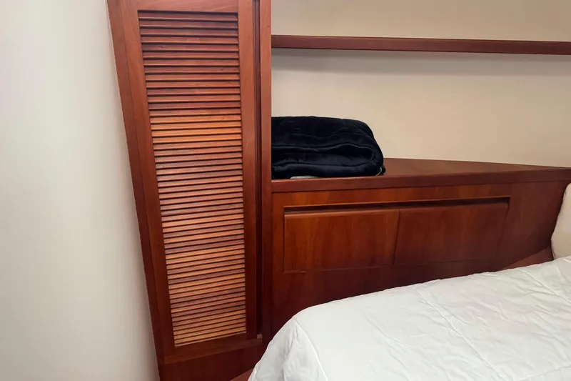 Slide: The Image of Engine room of 1998 Krogen Express 49 with Cummins Onan generator and mechanical components. - 61