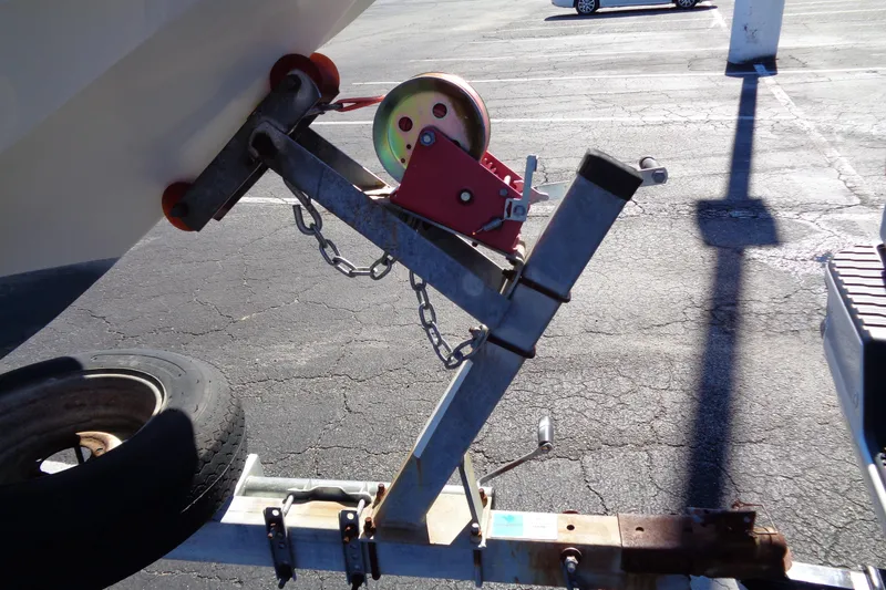 Slide: The Image of Trailer hitch and winch system for 1991 Wahoo 180 boat in parking lot. - 15
