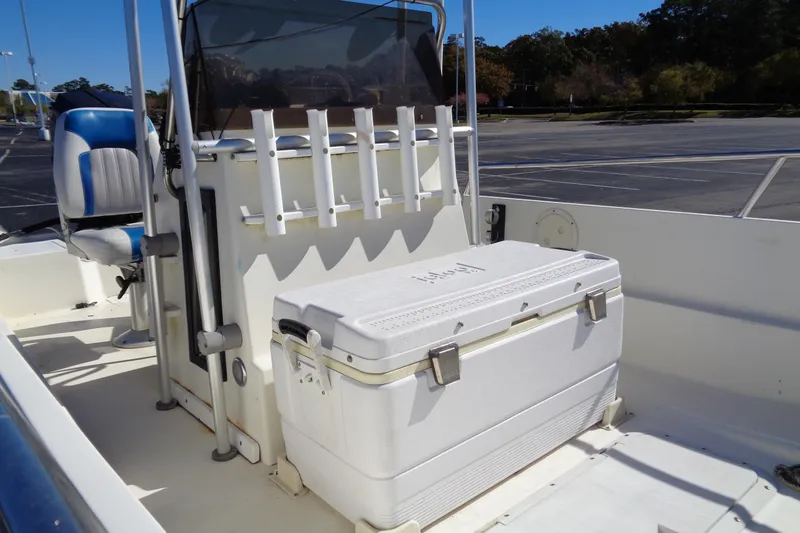 Slide: The Image of 1991 Wahoo 180 boat interior with seating and storage cooler. - 7