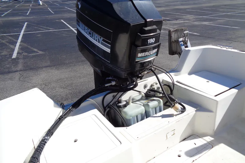 Slide: The Image of 1991 Wahoo 180 boat with Mercury 150 outboard motor in parking lot. - 9
