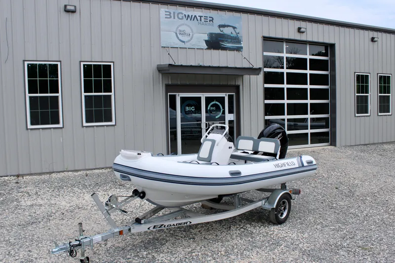 Slide: The Image of 2023 Highfield CL420 boat on trailer outside Big Water Marine building. - 5