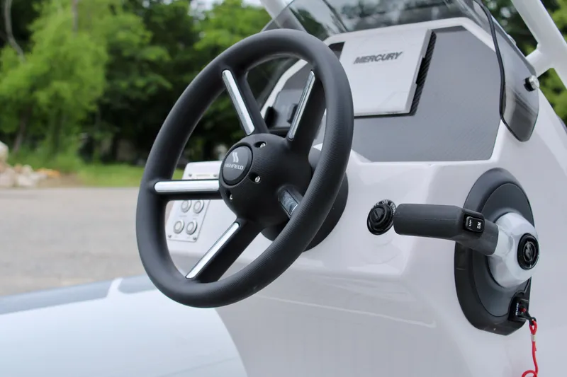 Slide: The Image of Steering console of 2023 Highfield CL420 boat with Mercury controls. - 6