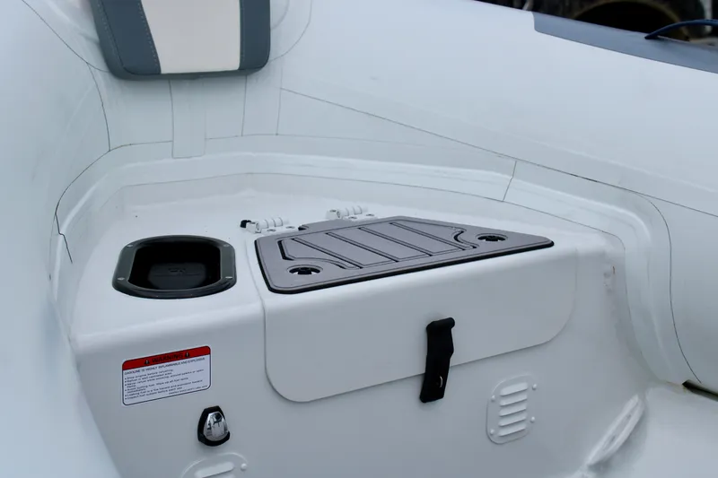 Slide: The Image of 2023 Highfield CL420 boat interior with storage compartment and seating. - 7