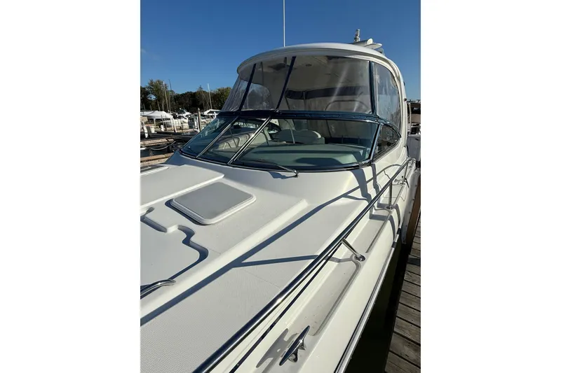 Slide: The Image of 2005 Formula 37 Performance Cruiser docked, showcasing sleek design and spacious deck. - 10