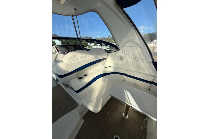 Slide: The Image of 2005 Formula 37 Performance Cruiser interior with white seating and blue accents. - 11