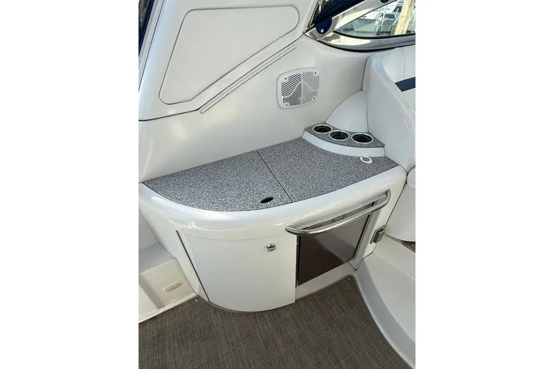 Slide: The Image of 2005 Formula 37 Performance Cruiser interior with countertop, cup holders, and storage. - 14