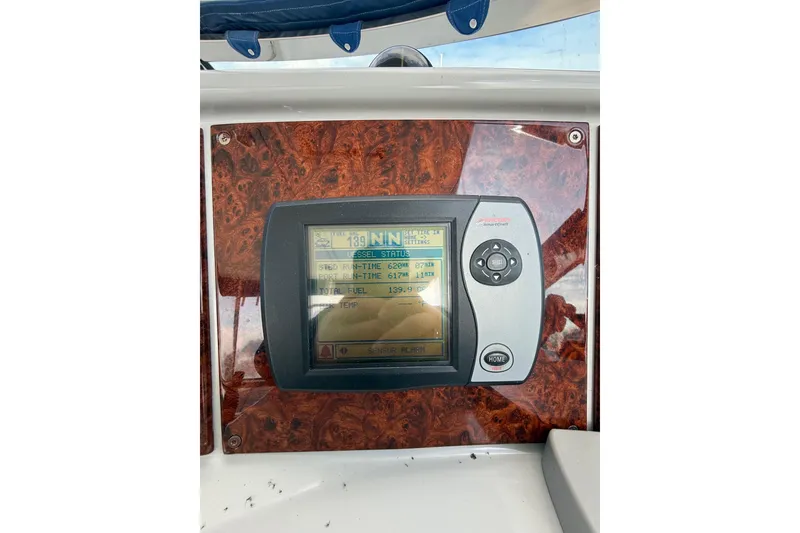 Slide: The Image of 2005 Formula 37 Performance Cruiser dashboard with digital display and controls. - 19