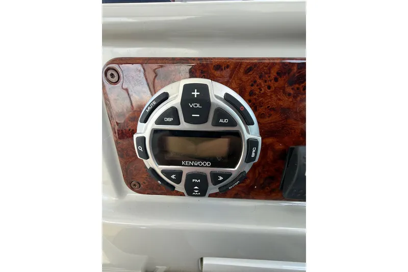 Slide: The Image of Kenwood audio control panel on 2005 Formula 37 Performance Cruiser dashboard. - 21