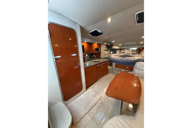 Slide: The Image of Interior of 2005 Formula 37 Performance Cruiser with wood finishes and modern amenities. - 24