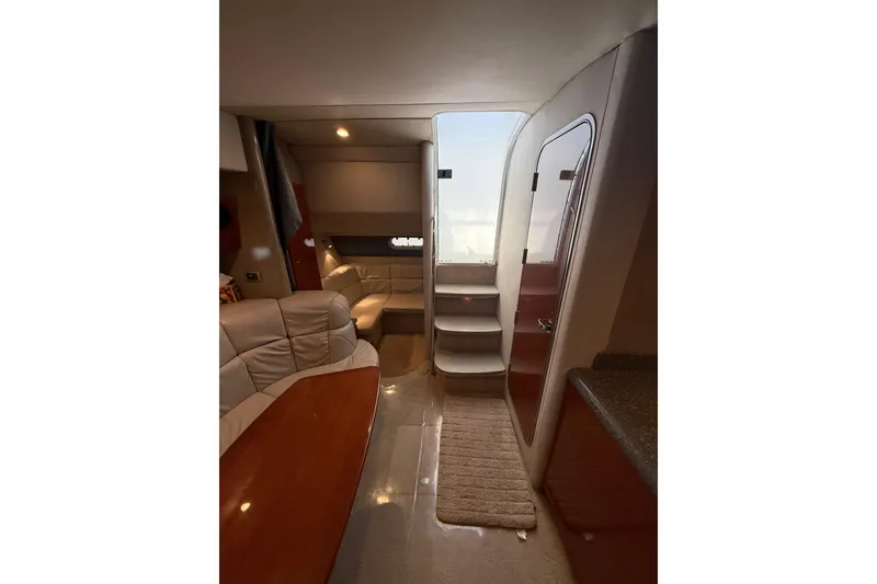 Slide: The Image of Interior of 2005 Formula 37 Performance Cruiser with seating, table, and stairs. - 32