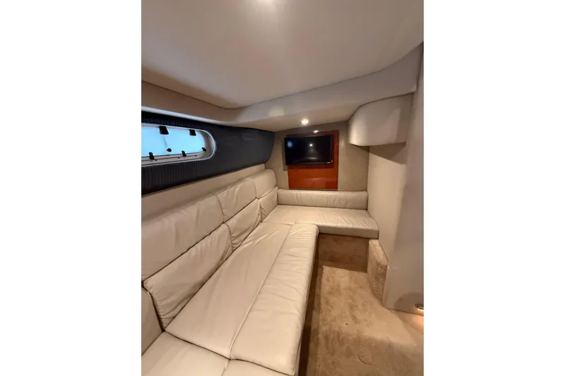 Slide: The Image of Interior of 2005 Formula 37 Performance Cruiser with beige seating and wall-mounted TV. - 33
