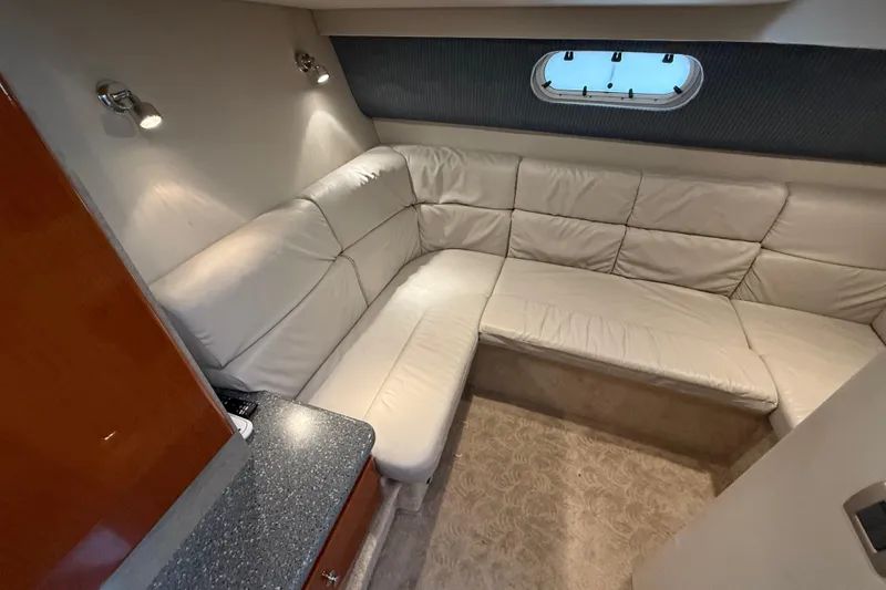 Slide: The Image of Interior of 2005 Formula 37 Performance Cruiser with plush white seating and modern lighting. - 34