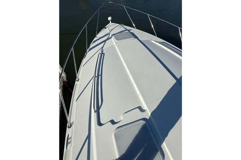 Slide: The Image of 2005 Formula 37 Performance Cruiser deck view, showcasing sleek design and railing. - 4