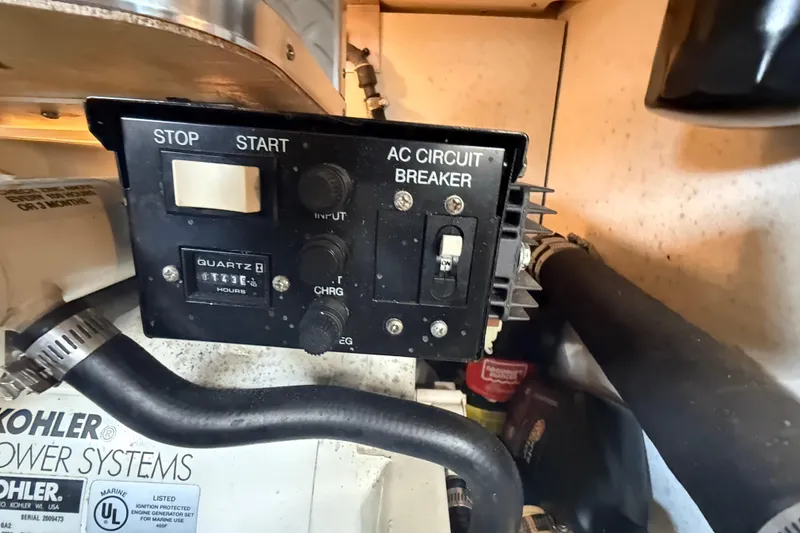 Slide: The Image of Control panel of a 2005 Formula 37 Performance Cruiser with AC circuit breaker. - 44